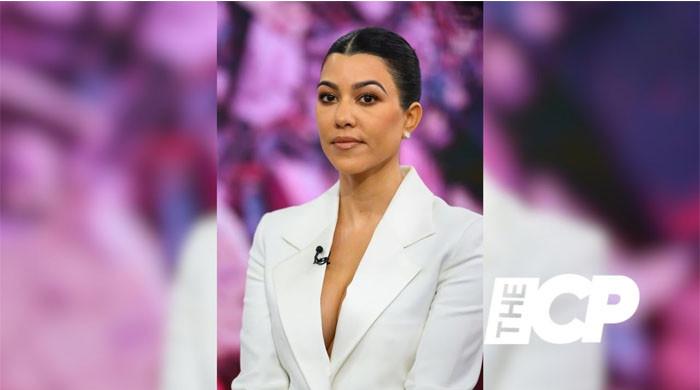 Kourtney Kardashian Puts Curves On Display In Sheer Lingerie