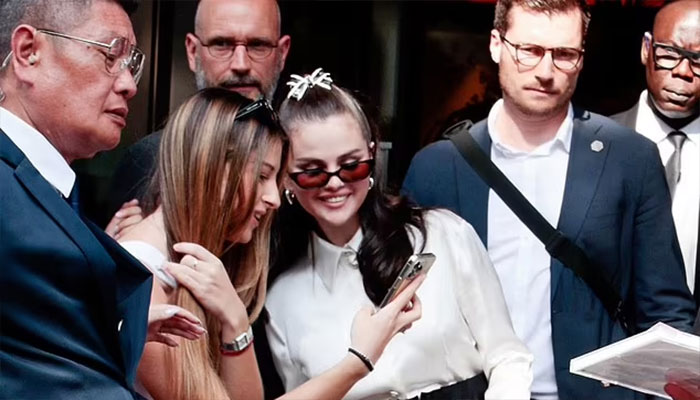 Selena Gomez charms fans at Rare Beauty event in Paris.