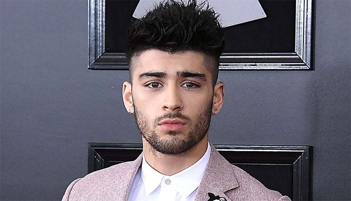 Zayn Malik ignites the Grammys red carpet with an irresistible allure, leaving hearts racing.