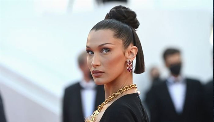 Bella Hadid bangs Paris Fashion Week sporting a new accessory.